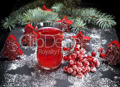 tea from fresh red viburnum in a transparent glass