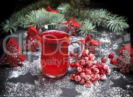 tea from fresh red viburnum in a transparent glass