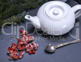 white ceramic brewer and a branch of a viburnum