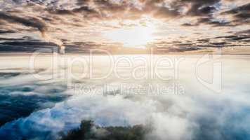 Riga city Autumn Drone flight above and sunrise above clouds