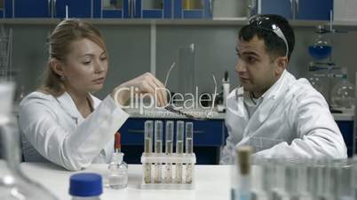 Pensive scientists thinking over bad results