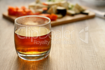 Tea in a glass on a wooden table