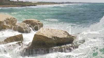 Rosh Hanikra coastline and sea waves crushing rocks