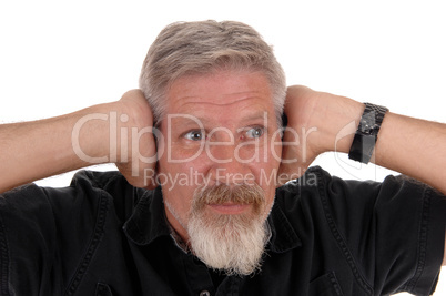 Man holding his hands over his ears
