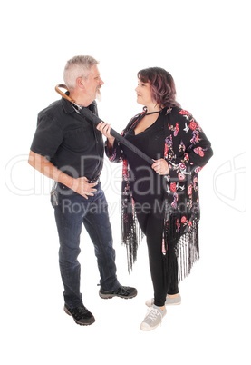 Middle age couple fighting with umbrella