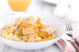 Braised chicken meat with carrot in sauce and pasta