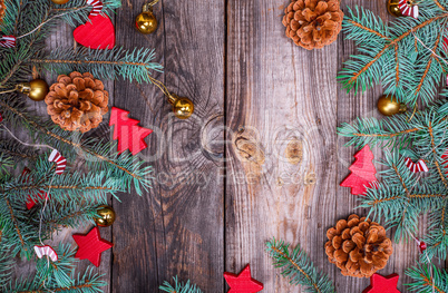 gray wood background with green spruce branches
