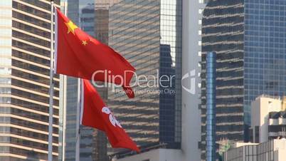 Flags of China and Hong Kong flying in the wind