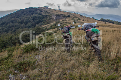 Enduro journey with dirt bike high in the mountains