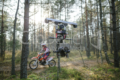 Enduro journey with dirt bike high in the mountains cablecam shooting