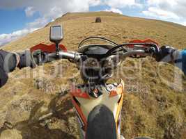 Enduro journey with dirt bike high in the mountains