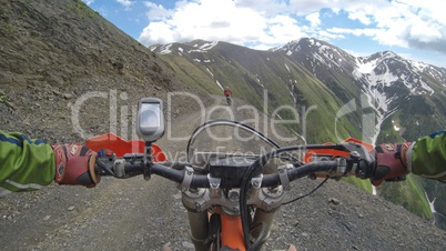 Enduro journey with dirt bike high in the mountains