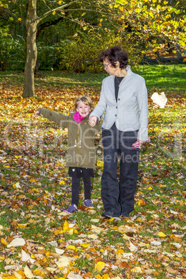 Woman with child in autumn park