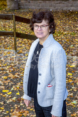 Woman walking in the autumnal park