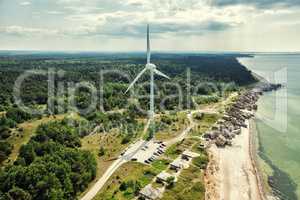 Electrical wind generator station near the blue sea in Liepaja