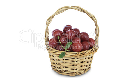 Cherries in a wicker basket isolated on a white background