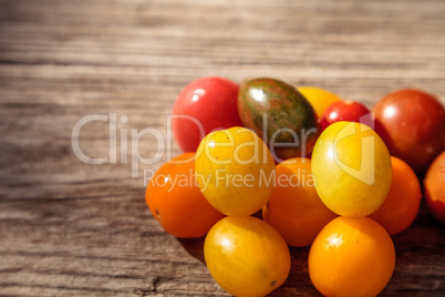 Bright colorful cherry tomatoes in red, yellow, green and purple