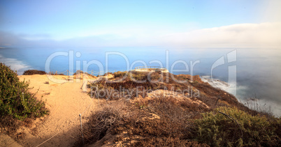 Fog drifts in over the ocean at Crystal Cove state beach