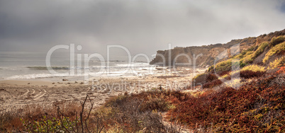Fog drifts in over the ocean at Crystal Cove state beach