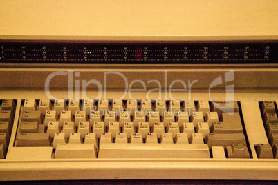 Keyboard of a tan old fashioned typewriter