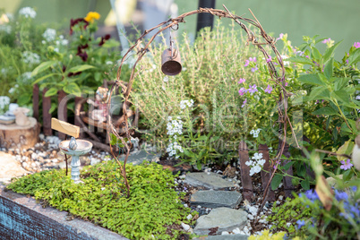 Bonsai mini garden planter scene set up in a garden