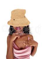 Young African woman with straw hat over eyes