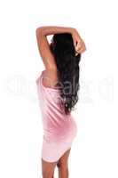 African woman in a pink dress from the back
