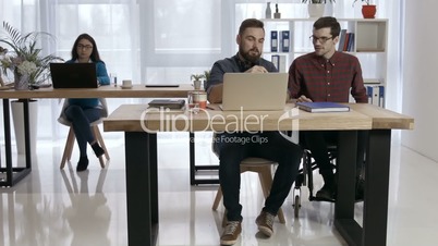 Handicap businessman discussing with colleague