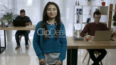 Portrait of attractive young asian woman at office