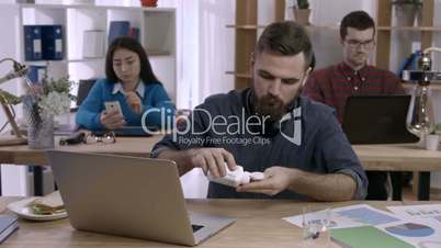 Office worker taking prescription medicine