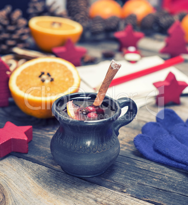 mulled wine in a brown ceramic cup