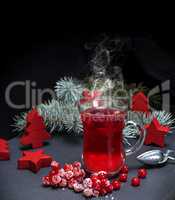 tea from fresh red viburnum in a transparent glass