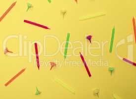 yellow background with wax candles for celebratory cake