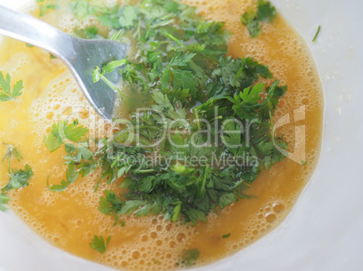 egg yolk with parsley in bowl