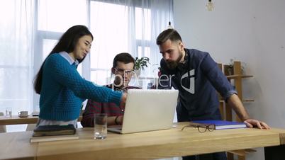 Group of coworkers sharing ideas about new project