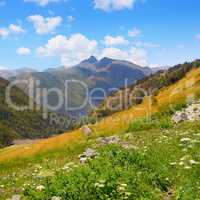Mountain landscape,meadow, hiking trail and beautiful sky.
