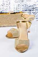 A pair of gold sandals