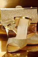A pair of gold shoes