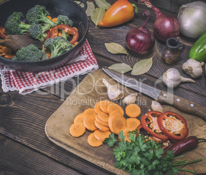 sliced carrots on a wooden kitchen board