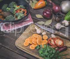 sliced carrots on a wooden kitchen board