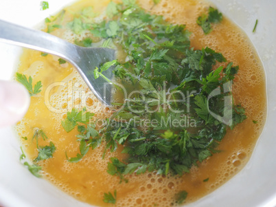 egg yolk with parsley in bowl