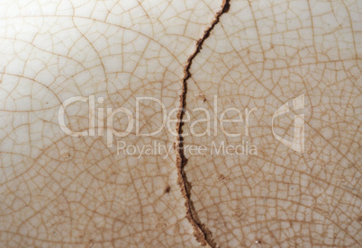 cracked brown ceramic texture background
