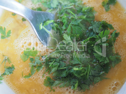 egg yolk with parsley in bowl