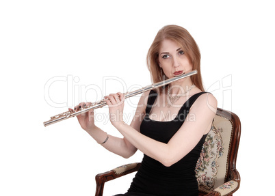 Close up of woman playing the flute
