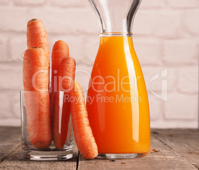 Juice with organic carrots on a table