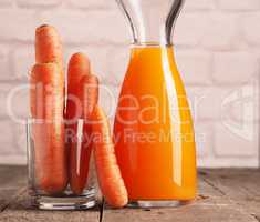 Juice with organic carrots on a table
