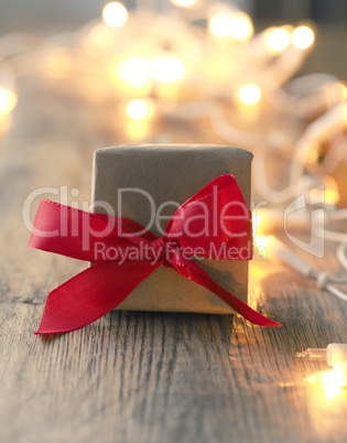 Christmas gift box with blurred lights