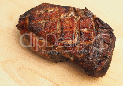 Roasted tasty goose breast on a wooden board