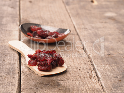 Delicious dried cranberries on wood