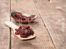 Delicious dried cranberries on wood